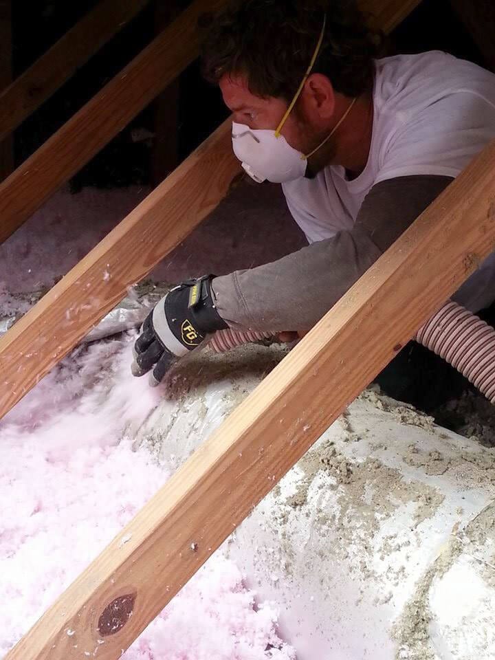 Done Rite Roofing contractor insatlling AttiCat insulation