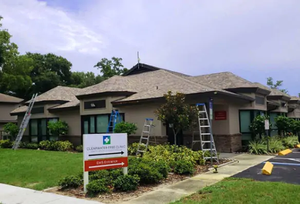 Commercial roof getting repairs by Done Rite Roofing.